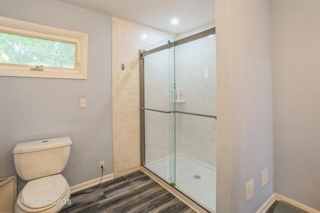 6N715 Gates Ave, Itasca, IL 60143 - bathroom featuring a stall shower, toilet, wood finished floors, baseboards, and recessed lighting