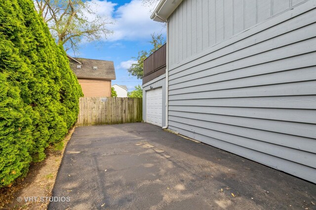 6N715 Gates Ave, Itasca, IL 60143 - view of patio with asphalt driveway and a garage