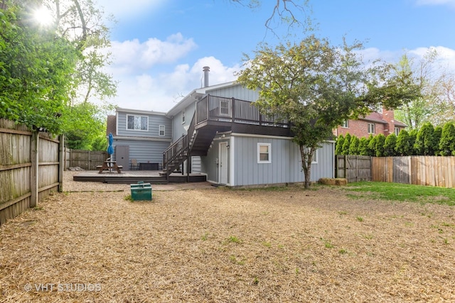 6N715 Gates Ave, Itasca, IL 60143 - rear view of house featuring a deck, stairway, a fenced backyard, and board and batten siding