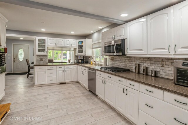 6N715 Gates Ave, Itasca, IL 60143 - kitchen with appliances with stainless steel finishes, a sink, glass insert cabinets, white cabinets, and recessed lighting