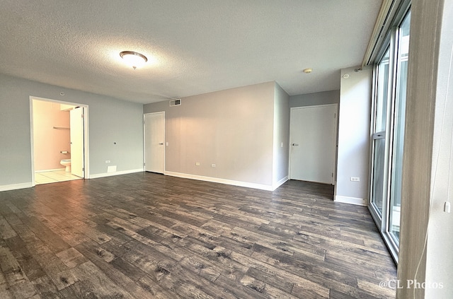 1580 Sherman Ave Unit 1005, Evanston, IL 60201 - unfurnished room with wood finished floors, baseboards, and a textured ceiling