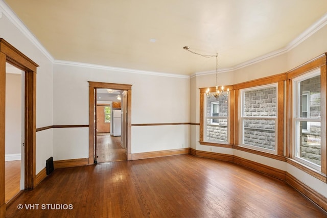 7223 Jackson Blvd, Forest Park, IL 60130 - empty room featuring a chandelier, hardwood / wood-style floors, baseboards, and crown molding