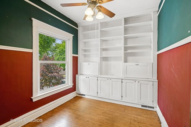 7223 Jackson Blvd, Forest Park, IL 60130 - empty room with baseboards, light wood-style flooring, and a ceiling fan