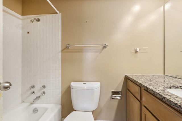 bathroom featuring vanity, shower / washtub combination, and toilet