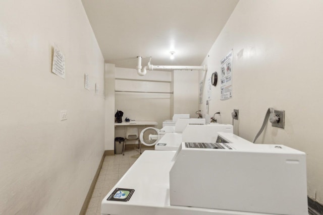shared laundry room with electric dryer hookup and baseboards