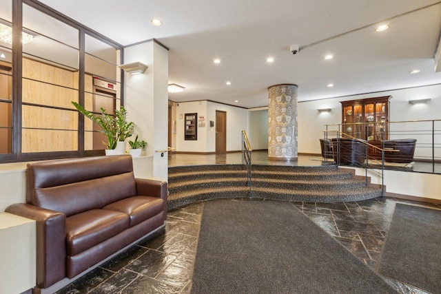 lobby featuring recessed lighting and a surveillance system