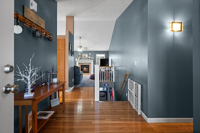 421 Sunset Dr, Colfax, IL 61728 - corridor featuring an upstairs landing, wood finished floors, and baseboards