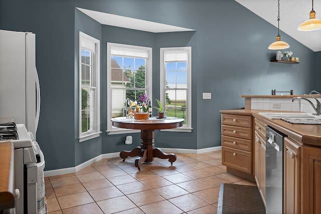 421 Sunset Dr, Colfax, IL 61728 - kitchen featuring a sink, gas range, stainless steel dishwasher, freestanding refrigerator, and hanging light fixtures