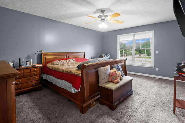 421 Sunset Dr, Colfax, IL 61728 - bedroom featuring carpet floors, baseboards, a textured ceiling, and a ceiling fan