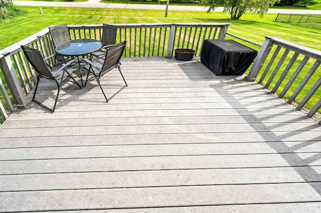 421 Sunset Dr, Colfax, IL 61728 - deck featuring outdoor dining space and a lawn