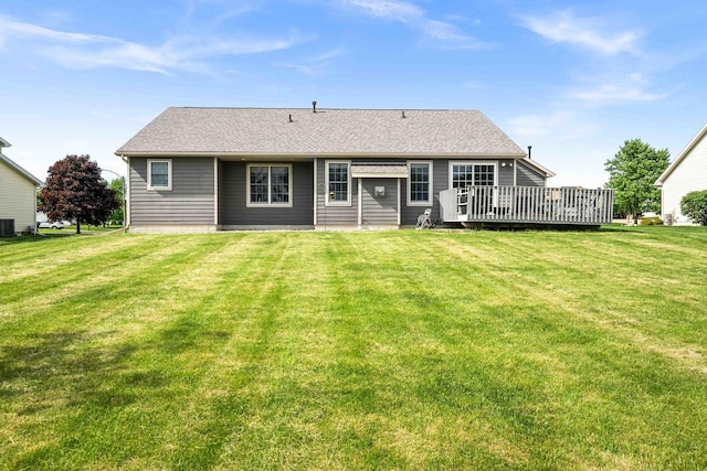 421 Sunset Dr, Colfax, IL 61728 - back of house with a wooden deck, a lawn, central AC unit, and a shingled roof