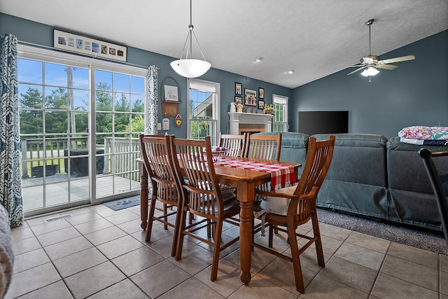 421 Sunset Dr, Colfax, IL 61728 - tiled dining area with lofted ceiling, ceiling fan, and a fireplace