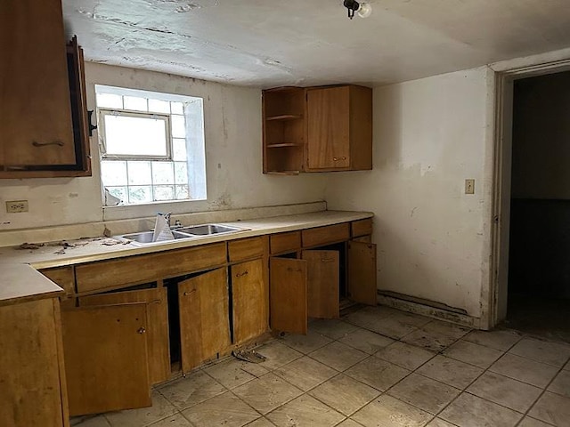 3010 N Nottingham Ave, Chicago, IL 60634 - kitchen with brown cabinets, open shelves, light countertops, and light tile patterned floors
