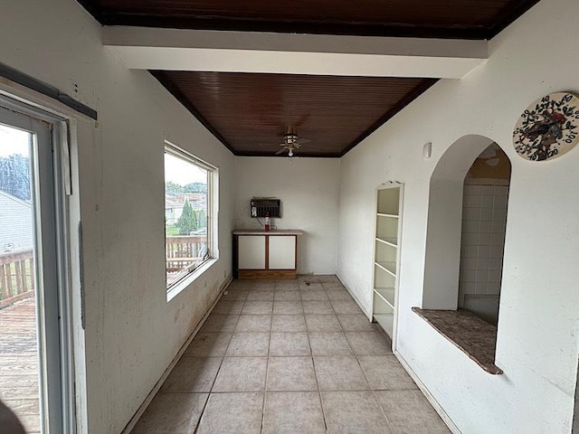 3010 N Nottingham Ave, Chicago, IL 60634 - hallway featuring light tile patterned floors, arched walkways, and wooden ceiling