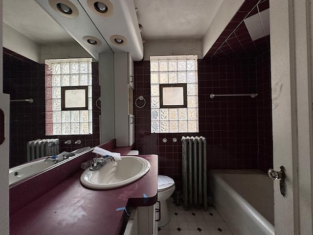3010 N Nottingham Ave, Chicago, IL 60634 - full bathroom featuring radiator, vanity, tile patterned floors, bathing tub / shower combination, and tile walls