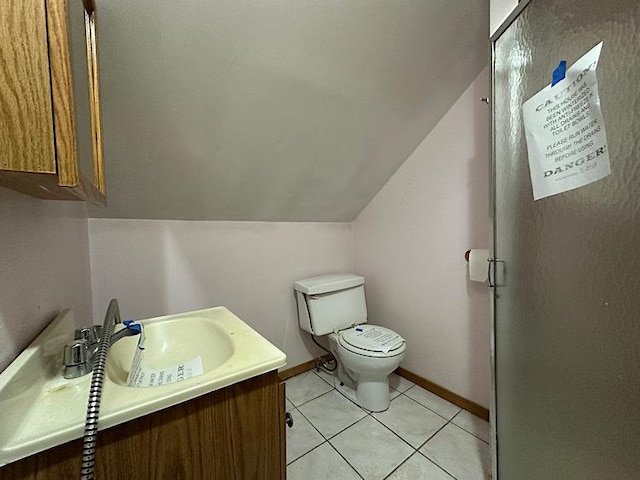 3010 N Nottingham Ave, Chicago, IL 60634 - bathroom with vanity, lofted ceiling, and tile patterned floors