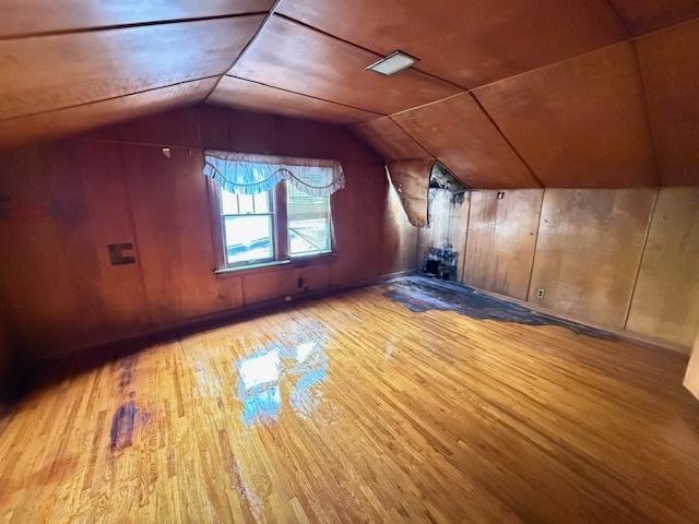 2843 N New England Ave, Chicago, IL 60634 - bonus room featuring wood finished floors, lofted ceiling, and wooden walls