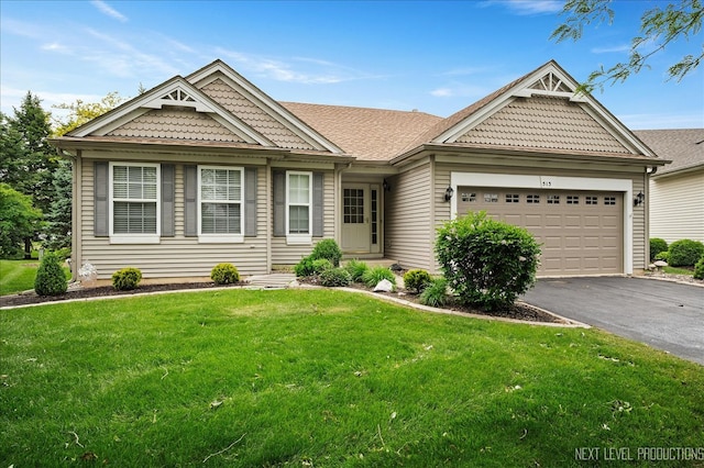 513 Coventry Ct, Oswego, IL 60543 - view of front of property featuring asphalt driveway, a garage, and a front lawn