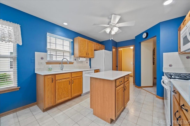 513 Coventry Ct, Oswego, IL 60543 - kitchen with white appliances, a sink, tasteful backsplash, a ceiling fan, and a center island