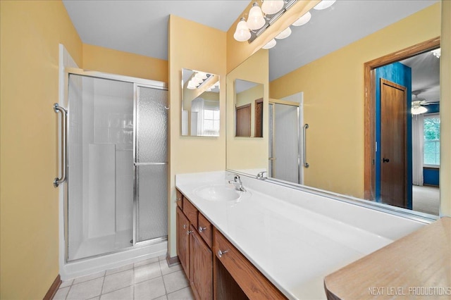 513 Coventry Ct, Oswego, IL 60543 - full bathroom with a shower stall, vanity, baseboards, and tile patterned floors