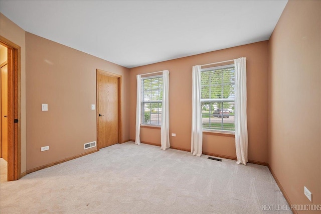 513 Coventry Ct, Oswego, IL 60543 - unfurnished room featuring light colored carpet and baseboards