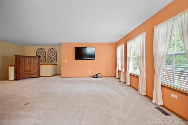 513 Coventry Ct, Oswego, IL 60543 - unfurnished living room with light carpet and baseboards