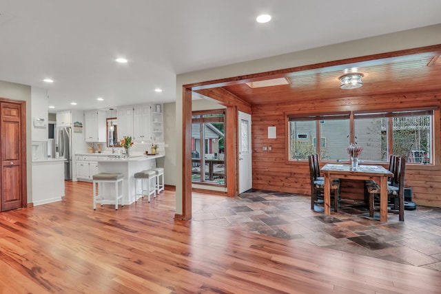 2407 N Villa Ln, Mchenry, IL 60051 - dining space with recessed lighting, wooden walls, and light wood-type flooring