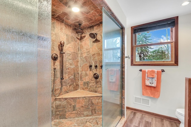 2407 N Villa Ln, Mchenry, IL 60051 - bathroom featuring a shower stall, wood finished floors, toilet, and baseboards