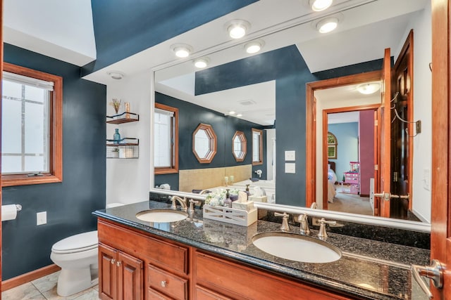 2407 N Villa Ln, Mchenry, IL 60051 - full bathroom featuring toilet, double vanity, baseboards, and tile patterned flooring