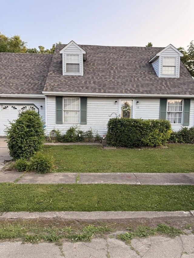 110 W Wayne Dr, Catlin, IL 61817 - cape cod home with a front lawn, a garage, and a shingled roof