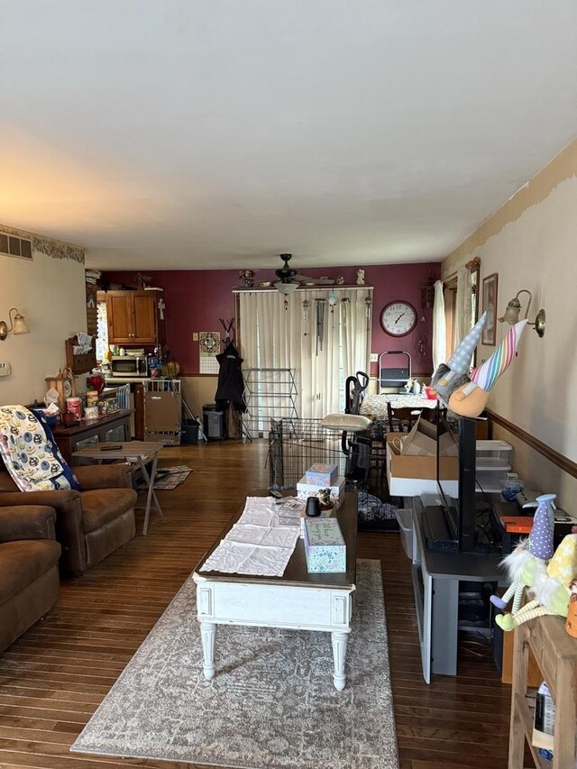 110 W Wayne Dr, Catlin, IL 61817 - living room featuring ceiling fan, dark wood finished floors, and healthy amount of natural light