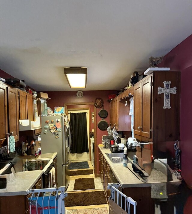 110 W Wayne Dr, Catlin, IL 61817 - kitchen featuring light countertops, black range with electric stovetop, ventilation hood, and freestanding refrigerator