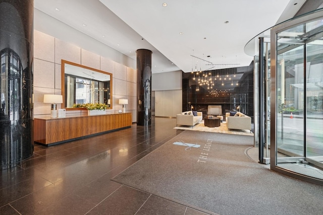 60 E Monroe St Unit 3007, Chicago, IL 60603 - reception area with a towering ceiling and a chandelier