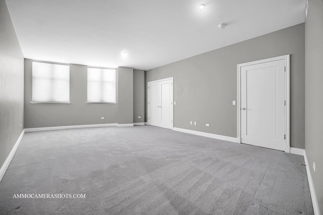 520 S Washington St Unit 201, Naperville, IL 60540 - carpeted empty room with baseboards and a smoke detector
