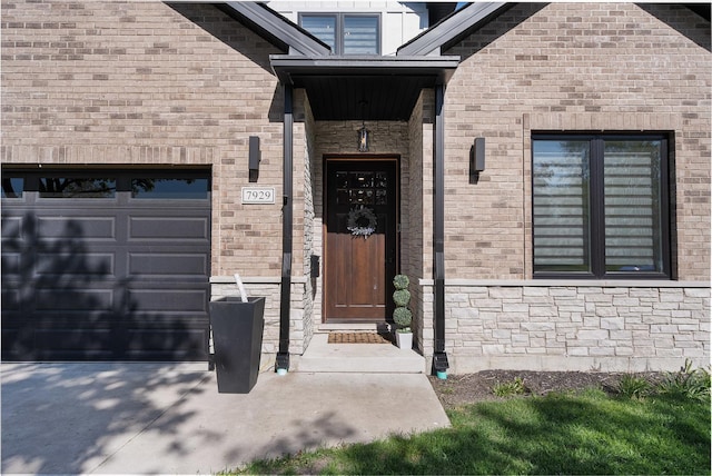 7929 N Octavia Ave, Niles, IL 60714 - property entrance with a garage, concrete driveway, and brick siding