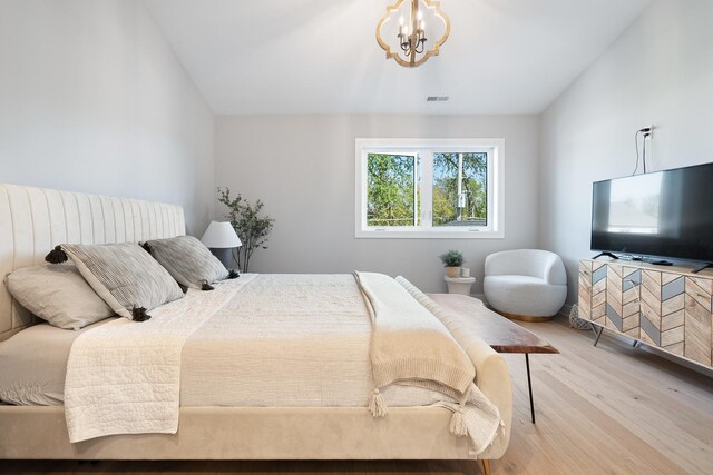 7929 N Octavia Ave, Niles, IL 60714 - bedroom featuring wood finished floors and a chandelier