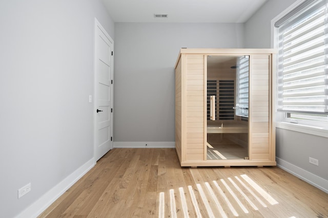 7929 N Octavia Ave, Niles, IL 60714 - unfurnished bedroom featuring wood finished floors and baseboards