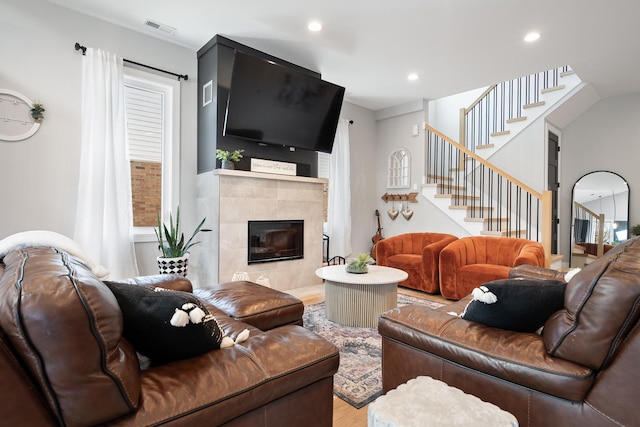 7929 N Octavia Ave, Niles, IL 60714 - living room with wood finished floors, stairway, a fireplace, and recessed lighting