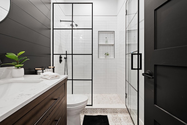 7929 N Octavia Ave, Niles, IL 60714 - full bath featuring toilet, a stall shower, vanity, and tile patterned flooring