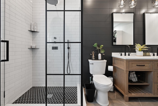 7929 N Octavia Ave, Niles, IL 60714 - bathroom featuring a stall shower, tile patterned flooring, toilet, and vanity