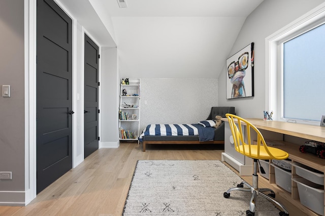 7929 N Octavia Ave, Niles, IL 60714 - bedroom featuring lofted ceiling, wood finished floors, and baseboards