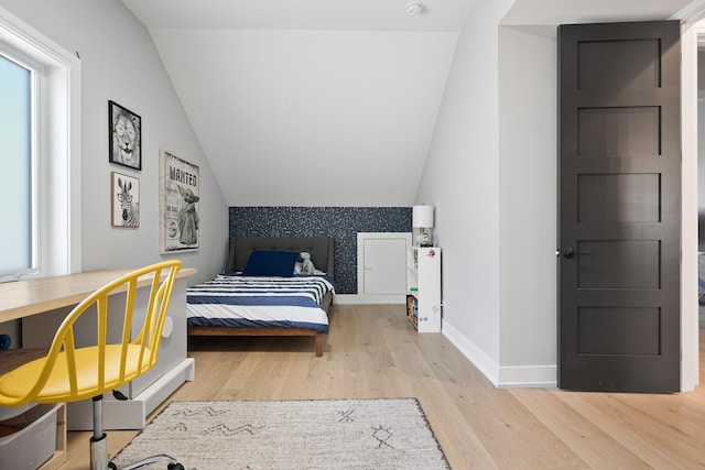 7929 N Octavia Ave, Niles, IL 60714 - bedroom with wood finished floors, lofted ceiling, and baseboards