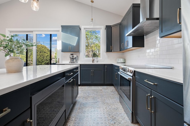 7929 N Octavia Ave, Niles, IL 60714 - kitchen featuring wall chimney range hood, stainless steel range with electric cooktop, a sink, vaulted ceiling, and light countertops