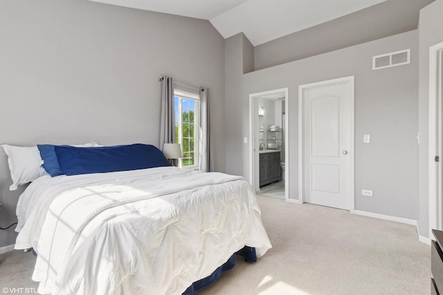 148 Azalea Cir Unit 0, Romeoville, IL 60446 - bedroom with vaulted ceiling, light colored carpet, baseboards, and connected bathroom