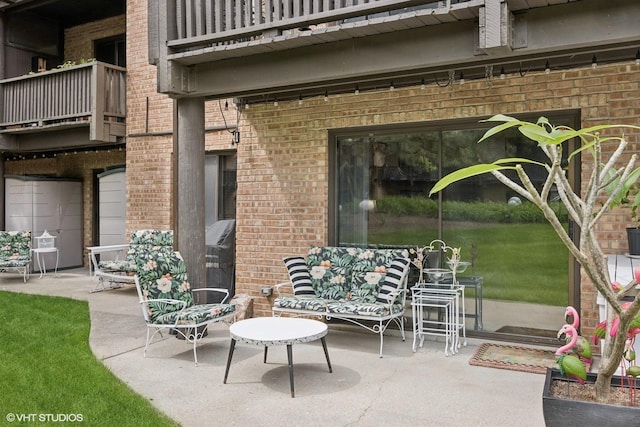 view of patio / terrace with a balcony