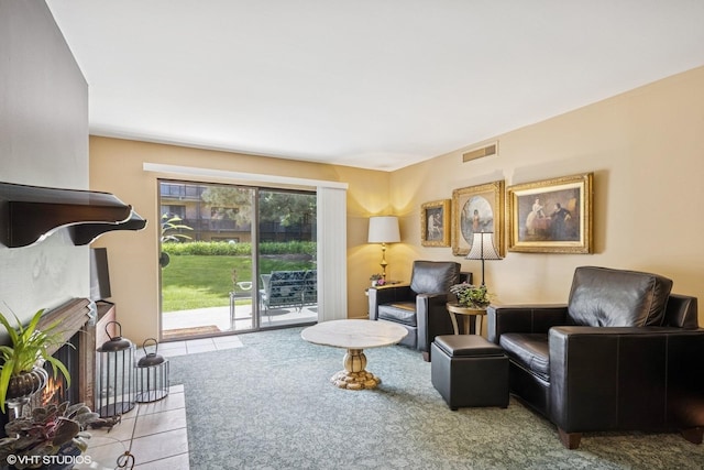 tiled living area with a lit fireplace