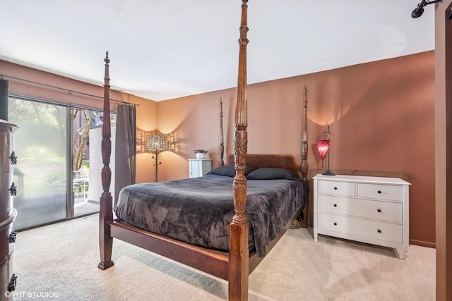 bedroom with access to exterior and carpet flooring