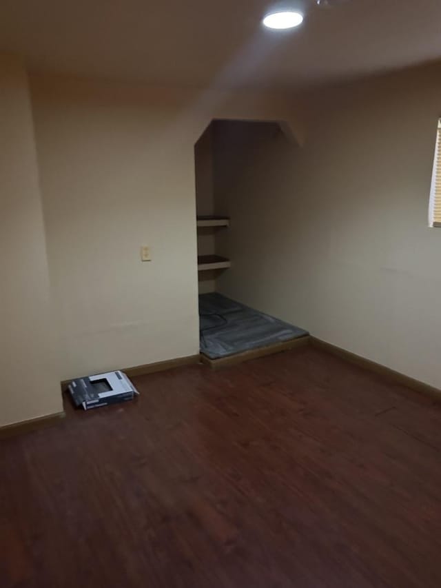 bonus room featuring baseboards, wood finished floors, and recessed lighting