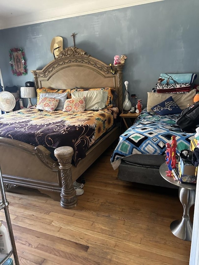 bedroom with wood finished floors