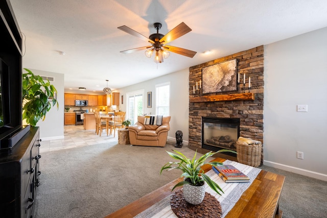 502 Deerpath St, Tolono, IL 61880 - living area with light carpet, a fireplace, and baseboards
